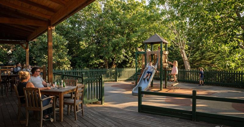 The playground seen from the deck tables